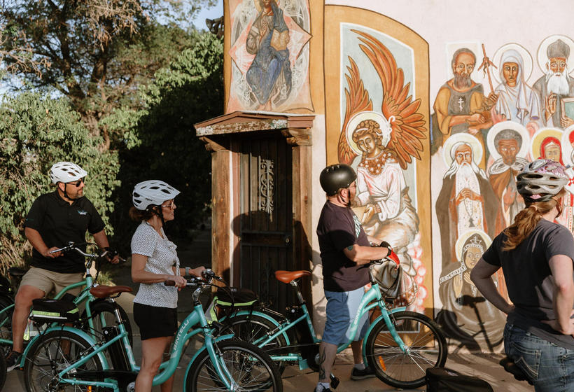 People on E-Bike tour in front of mural